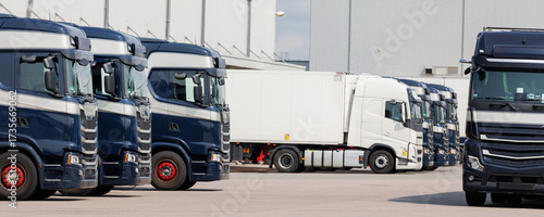 Photography Modern blue cargo truck delivery van parked logistics warehouse center complex building exterior bay