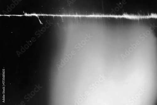 Abstract black and white scanner texture with noise, grain, static and glitch distortion background