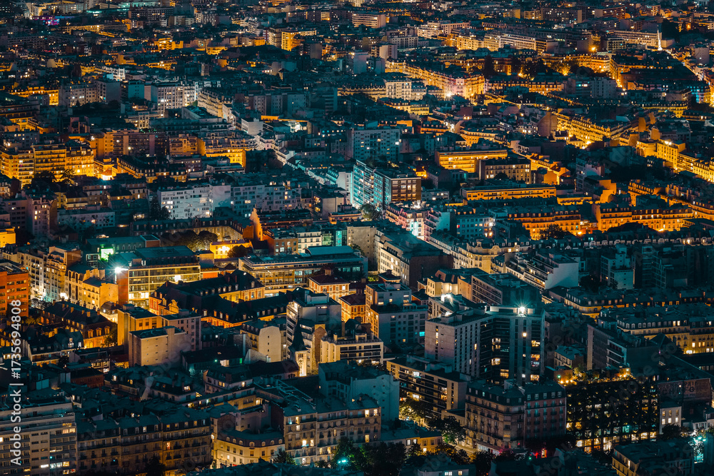 Obraz premium Aerial Night View of Paris City Lights and Rooftops