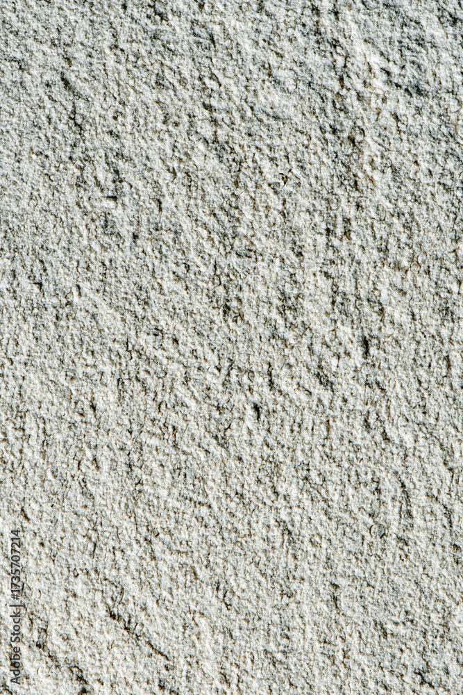 Fototapeta premium Close-up of rough white stucco wall texture