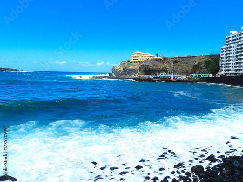Tenerife landscapes, picturesque coastline, ocean waves at sunset