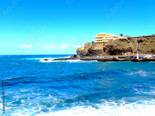 Tenerife landscapes, picturesque coastline, ocean waves at sunset