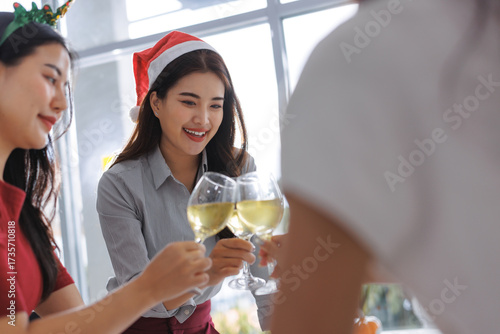 Photography Employees enjoying office christmas party toasting drinks