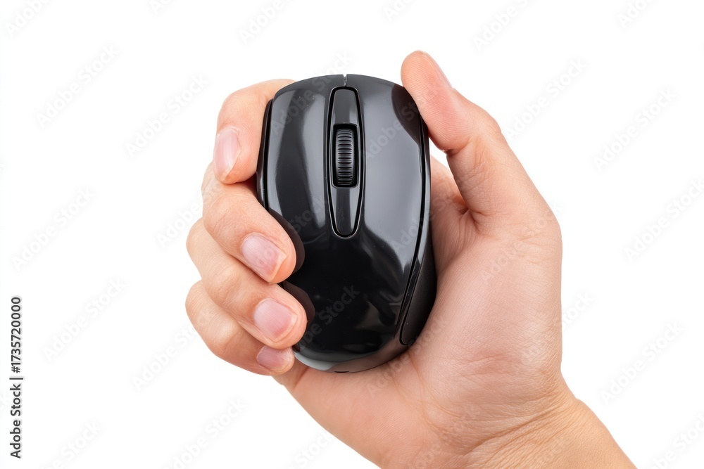 Fototapeta premium Hand holding a black wireless computer mouse on a white background.