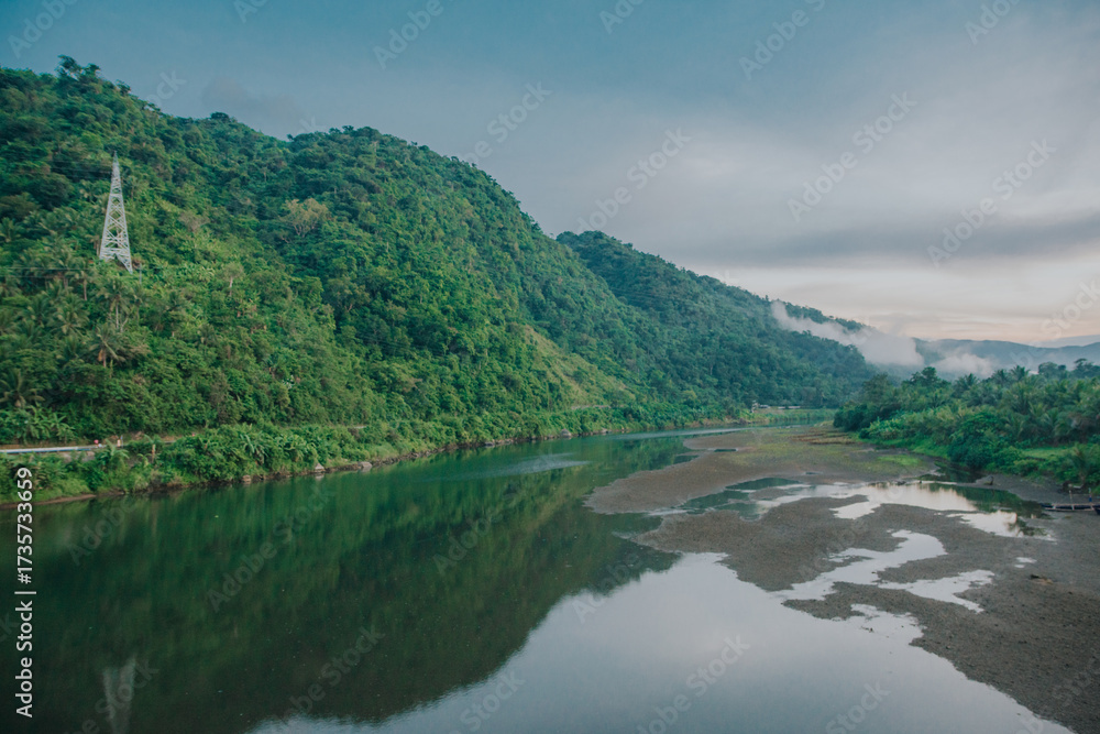 Fototapeta premium Bato River Landscape with Power Pylon and Low Water Level in Bato, Catanduanes, Bicol, Philippines
