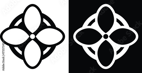 Black and white image of a flower-like design with four petals inside a circle.