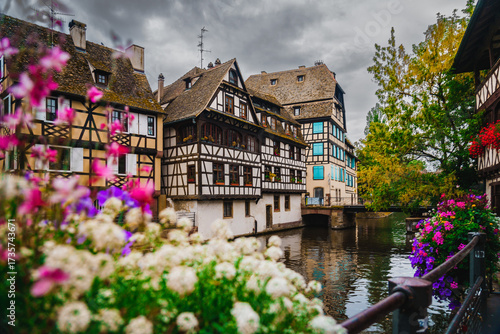 Photos Scenic Panorama of Strasbourg Canals with flowers and traditional architecture a