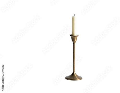 An elegant golden candlestick holds a single, unlit, cream-colored taper candle