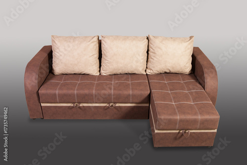 Isolated sofa bed with fabric upholstery on grey gradient background.