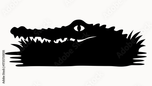 Silhouette of an alligator head with open mouth and sharp teeth in a swampy environment view