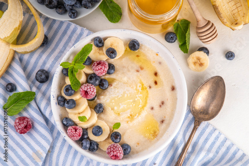Sweet breakfast farina porridge with butter and fruits