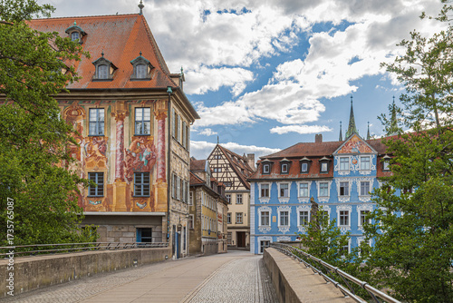 The medieval Untere Brücke, or Lower Bridge, in Bamberg, Bavaria, Germany, built in the 14th century, connects the banks of the Regnitz River right in the heart of the city's UNESCO-listed Old Town.