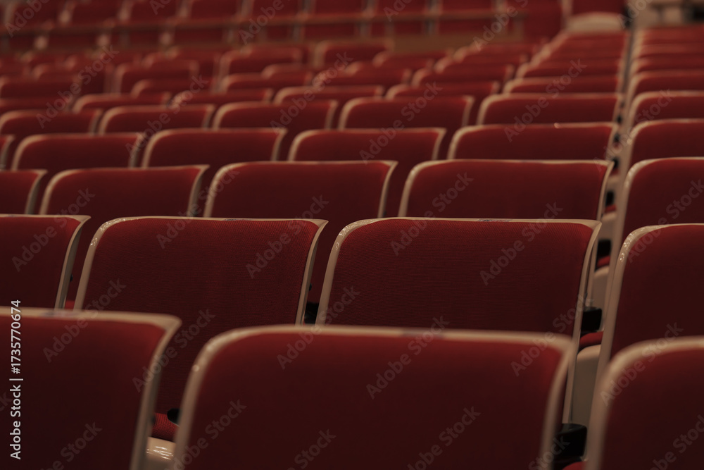 Naklejka premium rows of red seats in the cinema