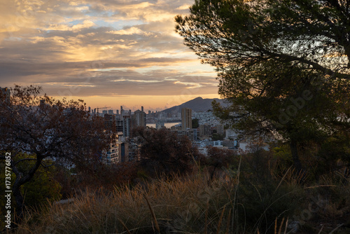 Panoramic view of a modern coastal city with high-rise buildings along the Mediterranean Sea.