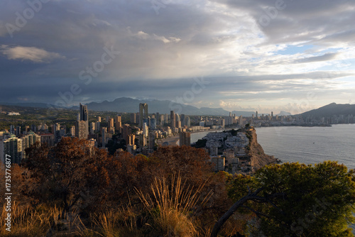 Panoramic view of a modern coastal city with high-rise buildings along the Mediterranean Sea.