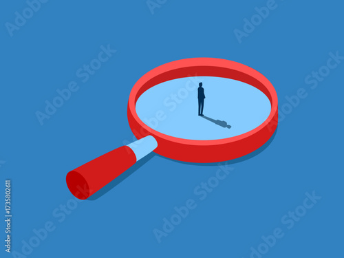 Businessman stands confidently in a magnifying glass