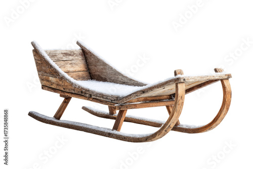 A beautifully weathered old wooden sleigh, lightly dusted with fresh snow, stands ready for winter adventures, evoking rustic charm. background removed