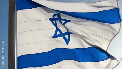 Israeli Flag Waving Proudly Against a Clear Blue Sky.