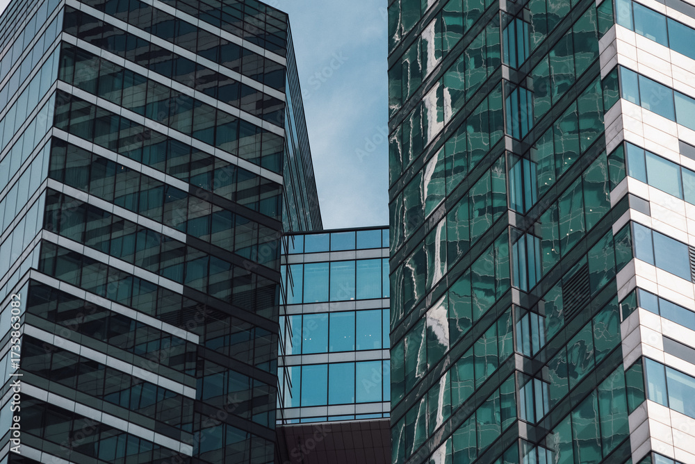 Fototapeta premium mirrored windows of the facade of an office building 