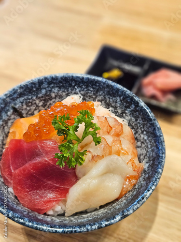 Mixed raw fish, salmon , tuna , Hotate scallop and prawn sashimi with rice