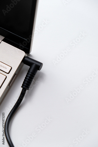 Wallpaper Mural Charging laptop with power adapter isolated on white background Torontodigital.ca