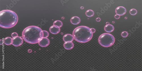 Bright pink and purple soap bubbles with light reflection float on a black background