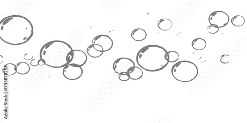 Bubbles in water on a black background creating a round blue and silver light decoration pattern