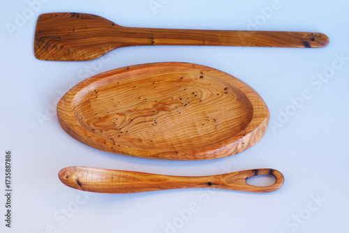 Wooden kitchen utensils stacked view close up isolated