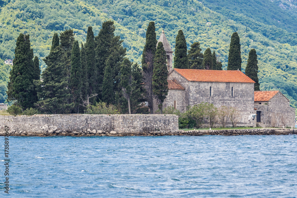 Fototapeta premium Monastery and church on the famous Sveti Dorge islet in the Kotor Bay, near Perast town, Montenegro