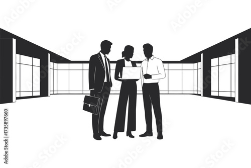 Business professionals discussing plans in a modern office hallway