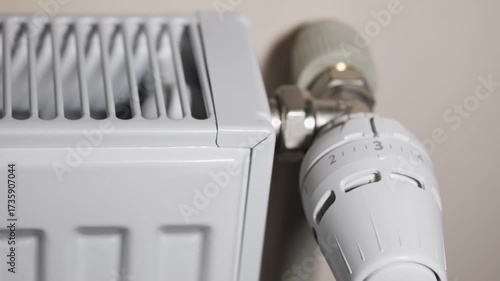 Radiator with thermostat valve in the home.