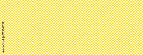 A repeating pattern of yellow and white squares forming a checkered design with a uniform appearance