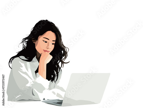 A young woman with long hair sits thoughtfully at a desk, using her laptop. She appears engaged in her work, lost in thought.
