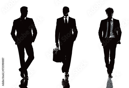 Three business professionals in formal suits walk confidently together. They carry briefcases and exude a sense of purpose and determination.