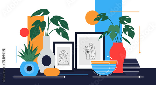 A collection of artistic framed prints and potted plants on a shelf.