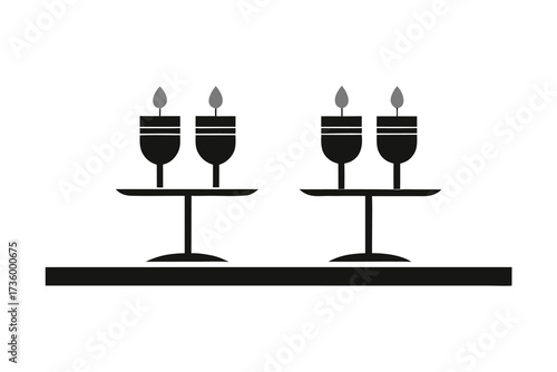 Two Candle Holders with Lit Candles Sitting On Table, Black and White Silhouette Style