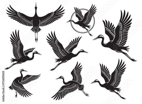Graceful set of cranes in flight silhouettes, capturing the elegance of this large bird, perfect for logos. Birds.