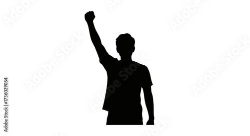 Powerful silhouette of a person repssing a clenched fist, symbolizing protest, revolution, strength, and triumphant unity.