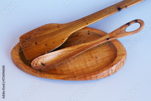 Wooden kitchen utensils stacked view close up isolated