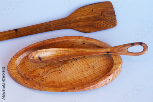 Wooden kitchen utensils stacked view close up isolated