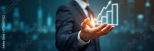 A businessman reaches out, touching a growing business graph symbolizing progress and success. The image captures the essence of startup investment, with copious copy space for targeted messaging.