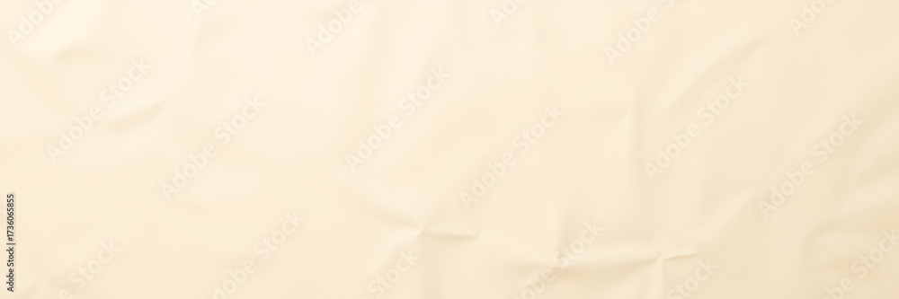 Obraz premium A background of light beige wrinkled paper recycled from packaging creates a subtle, textured aesthetic ideal for artistic displays or creative presentations, featuring ample space for text.