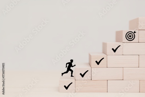 Business goal achievement and career growth concept. A silhouette figure runs up a staircase of accomplishments marked with checkmarks towards a final target