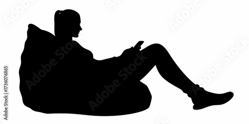Comfortable young woman relaxing on a cozy beanbag, engrossed in her smartphone, perfect for illustrating modern digital leisure.