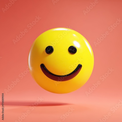 Cheerful Yellow Smiley Face Floating on Coral Background, Expressing Happiness and Positivity.