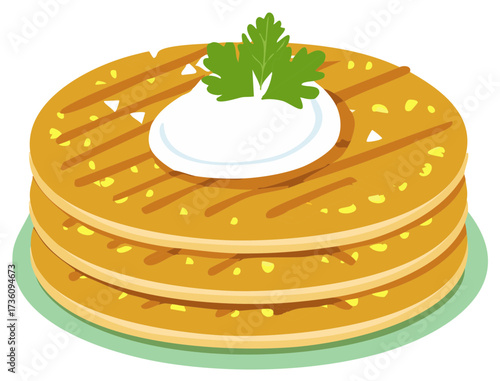 Stack of golden pancakes topped with white cream and fresh green herb garnish