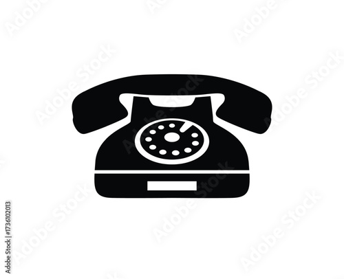 A solid black silhouette/icon of a vintage rotary dial telephone.