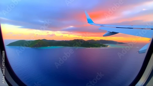 Airplane Window View of a Tropical Sunset Over Islands