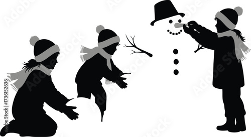 Children building a snowman together on a snowy winter day