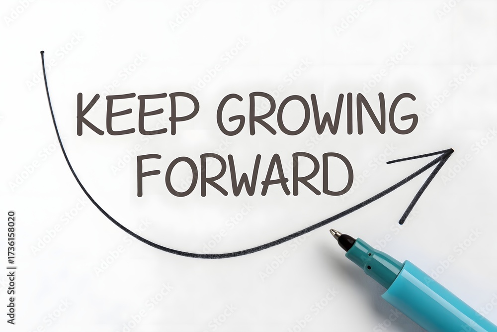 Obraz premium Inspirational Message Encouraging Personal Growth and Progress With a Pen on Paper